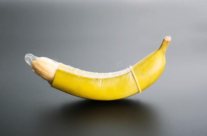 banana-condom-grey-background-47130120.jpg